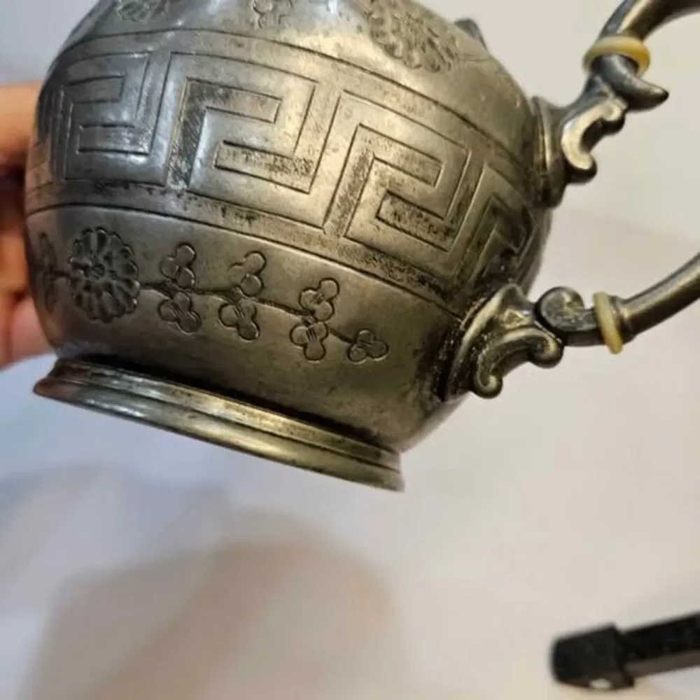 Antique silver-plated teapot Greek key pattern & embossed floral motifs.